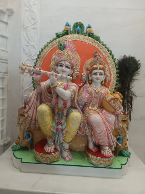 Radha Krishna on orange throne